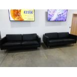 Pair of black leather effect three seater sofas