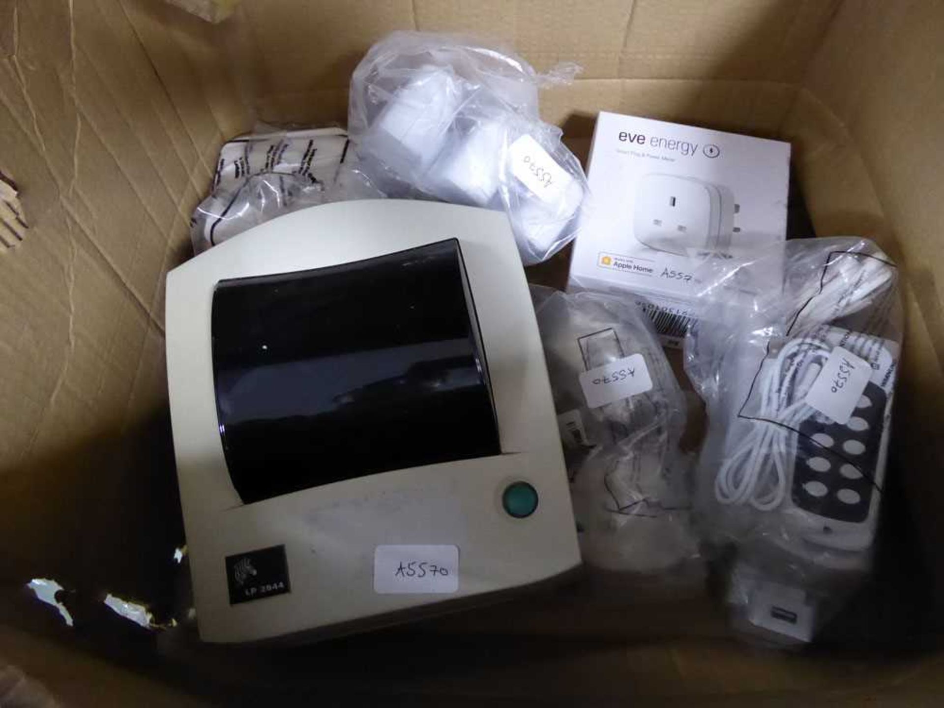 Box of various parts including a Zebra label printer, model no. LP2844 an Eve energy plug and