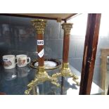 Pair of brass and copper candlesticks with Corinthian columns
