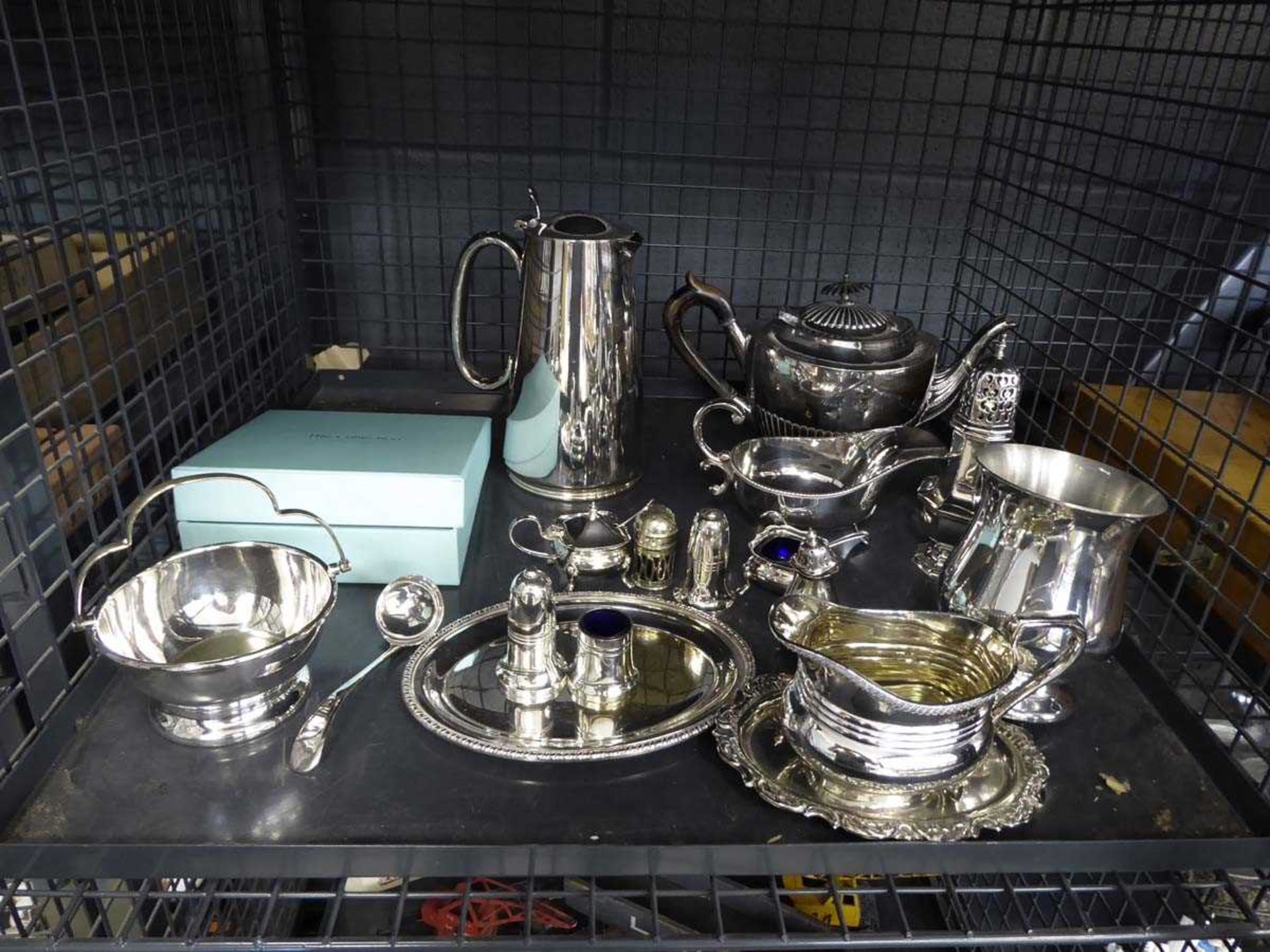 Cage containing silver plate ware inc. tea service, gravy boat, dishes, mustard pot, salt and pepper