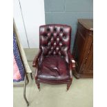 Maroon leather effect button back armchair