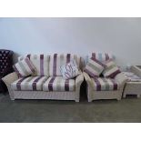 Wicker three seat sofa with cushions and matching footstool, armchair and three lamp tables