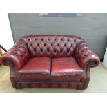 Maroon leather effect chesterfield two seater sofa