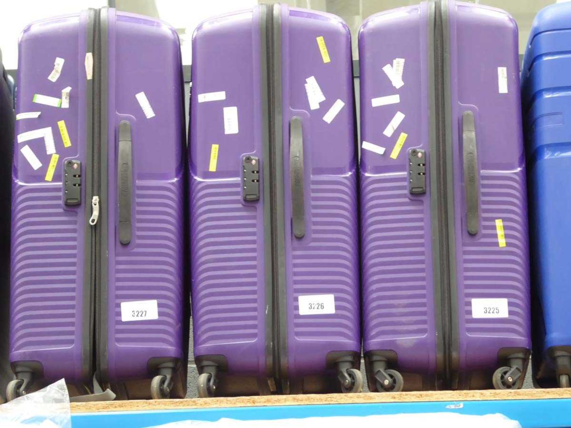 +VAT LArge hard shelled purple American Tourister suitcase