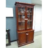 Victorian glazed bookcase with double door cupboard base under