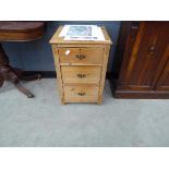 Stripped pine three drawer bedside cabinet