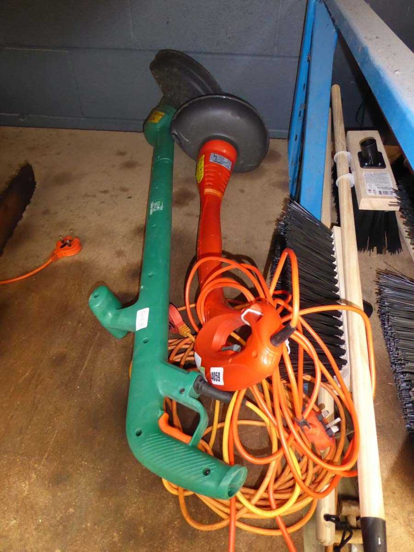 Two electric strimmers