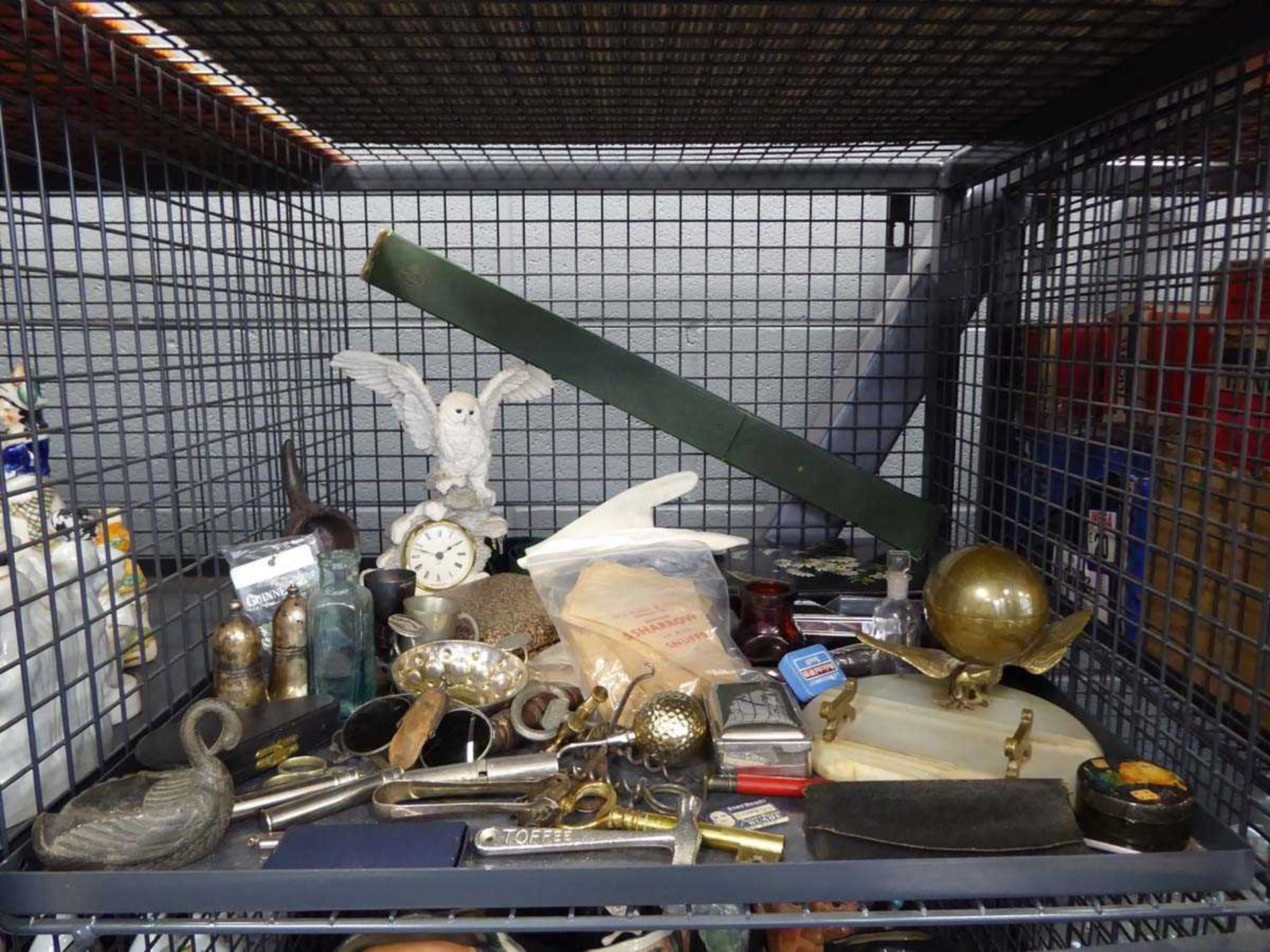 Cage containing corkscrews, bottle openers, desk tidy, ornamental figures, general silver-plate,