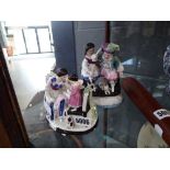2 x Staffordshire figures - mother and child and couple with pets