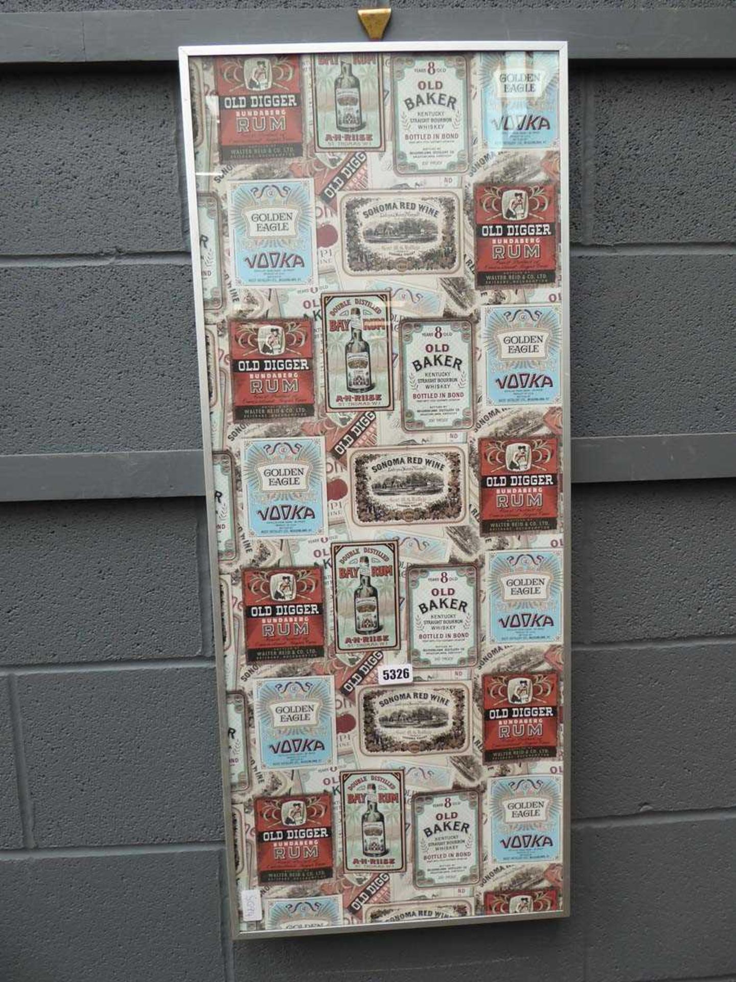 Wall hanging with alcohol bottle labels