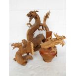 Wood carved sculpture of a rearing dragon together with a similar smaller dragon and vase, 3 further