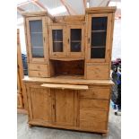 Early 20th Century pine dresser with 4 drawers to base, pull out work surface and glazed cabinets