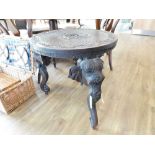 Hand carved circular elephant table with bone tusks