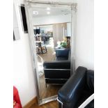 +VAT Large rectangular wall mirror with silver coloured decorative frame (29 x 65in. approx.)