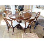 Circular Victoria rosewood single pedestal dining table with 6 cream upholstered dining chairs