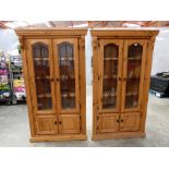 Modern pair of pine corner display cabinets with leaded glass doors