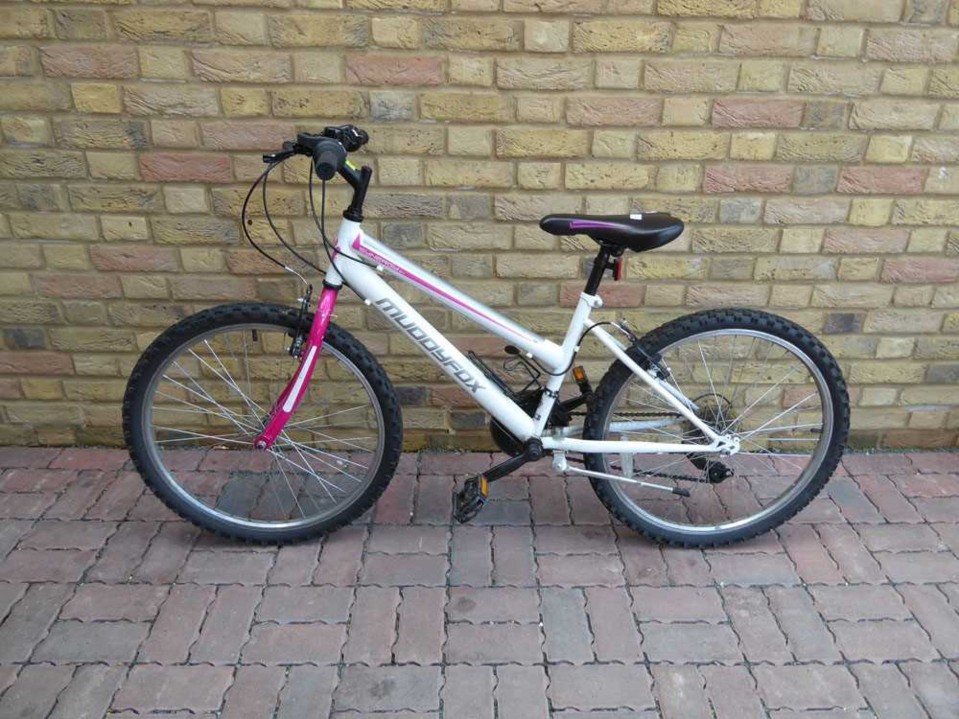 Girls Muddy Fox mountain bike in pink and white