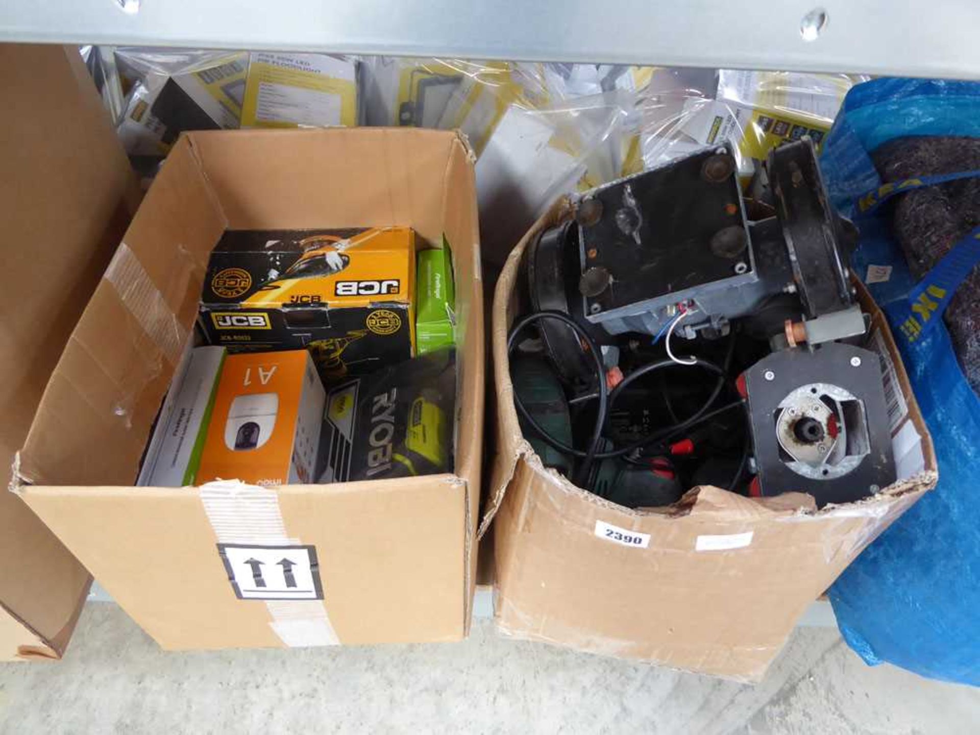 2 boxes containing mixed electric tooling and security cameras to include a bench grinder, jigsaw,