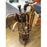 Modern stick stand and contents of various walking sticks including ebony and bone inlaid silver