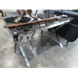 Modern chrome framed dining table with glass surface