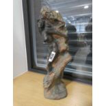 Ornament of nude on a rock by Tim Pottsfor Heredities Ltd.
