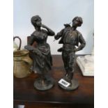 Pair of facinated metal figures