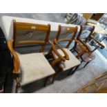 Pair of yew framed carver dining chairs and one further dark oak panel seated carver chair