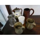 Single handled Ilfracombe jug, single handled leather covered tankard, pair of stoneware mugs,