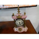 Pink and white ceramic ornate mantle clock with brass detail