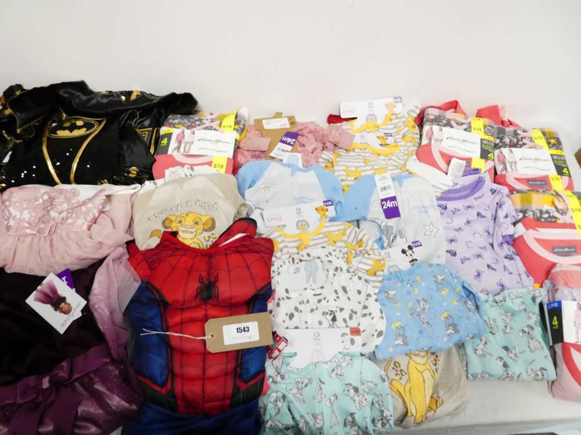 Bag containing 23 items of children's clothing including pyjamas, onesies, dresses and dressing up