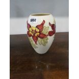 Moorcroft red clematis patterned vase of typical form
