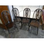 Set of 4 dark oak wheel back type dining chairs