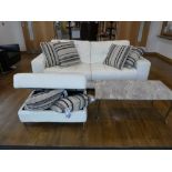 Modern beige upholstered 3 seater leather sofa with matching storage footstool