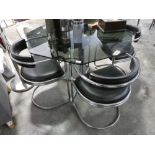 Smoked green glass octagonal topped dining table on single pedestal chrome support with set of