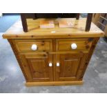 Modern pine sideboard with 2 drawers and 2 cupboard doors having white ceramic handles