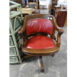 Mahogany craned red leather upholstered captains type study chair on 4 star support