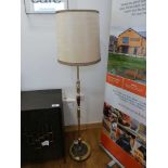 Wooden and brass effect standard lamp with cylindrical cream shade