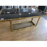 +VAT Modern gold finish dining table with black glass bevelled surfaceminor chip to corner of glass