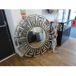 +VAT Large circular bevelled mirror with a mirrored geometric patterned frame