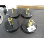 +VAT Four black and gold finish candle holders