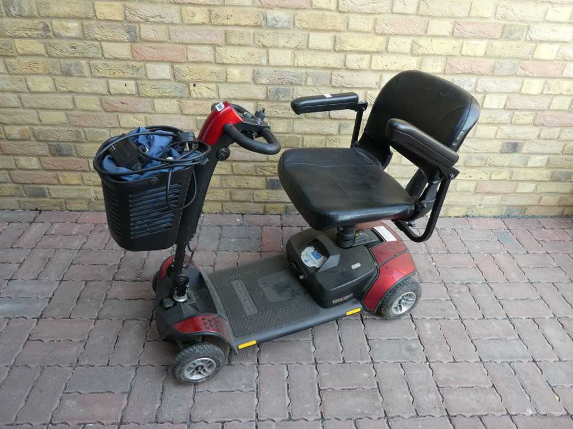 4 wheeled battery operated mobility scooter complete with charger and key