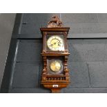 Mahogany cased clock with horse venial and pendulum