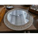 Circular mirror in silver coloured frame