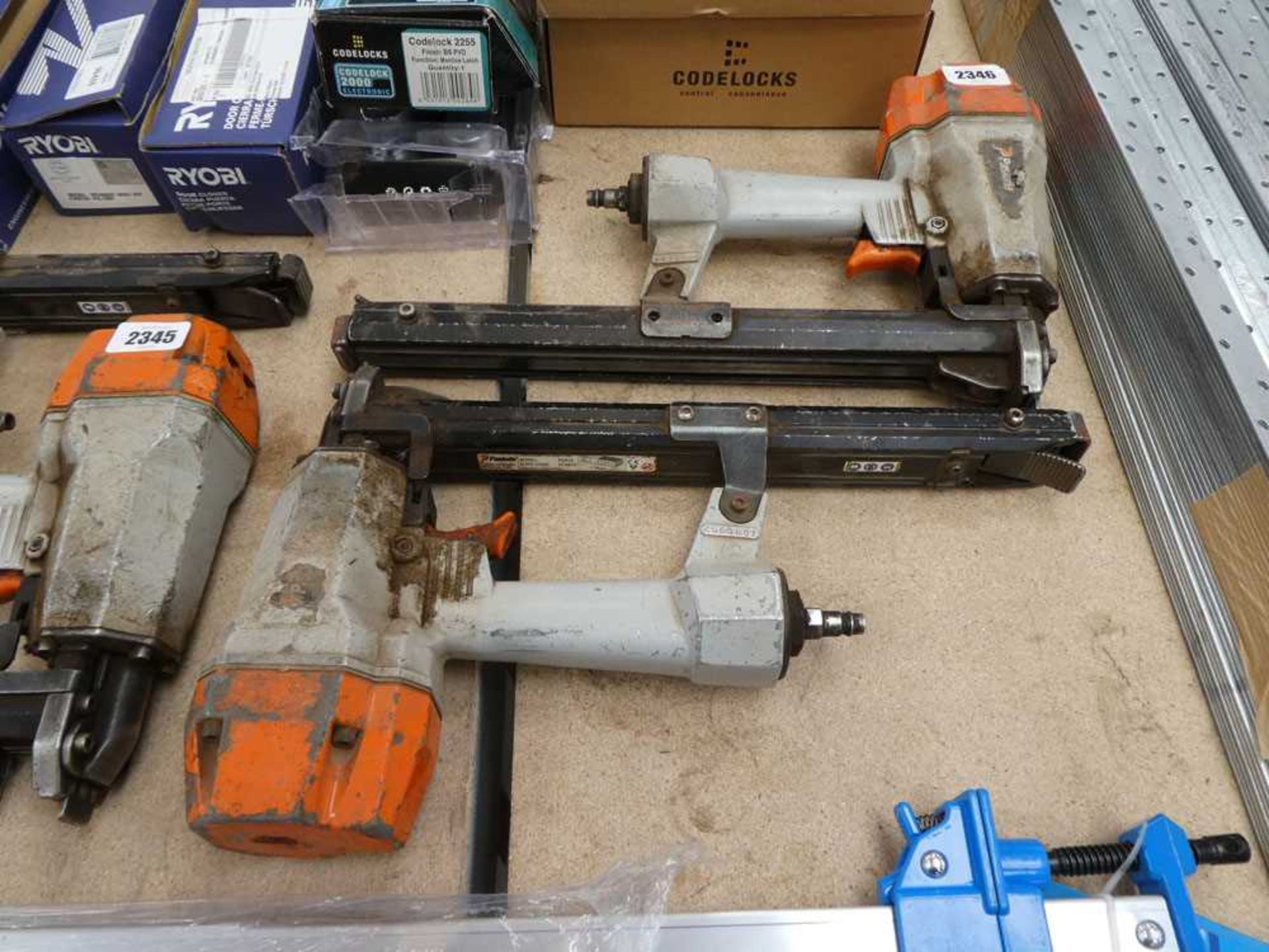 Pair of Paslode air operated nail guns