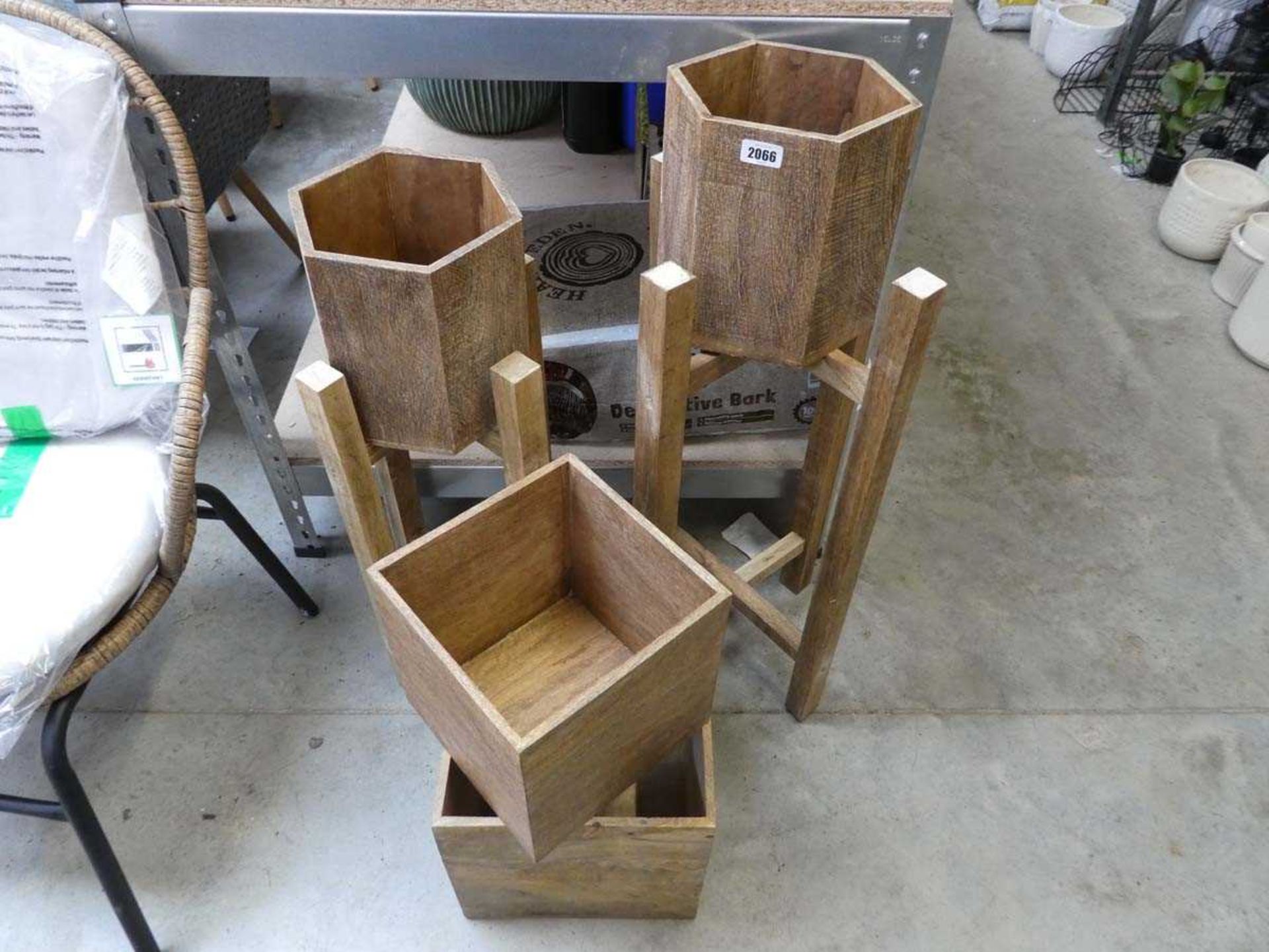 Pair of wooden garden plant pots on stand together with pair of square wooden plant pots