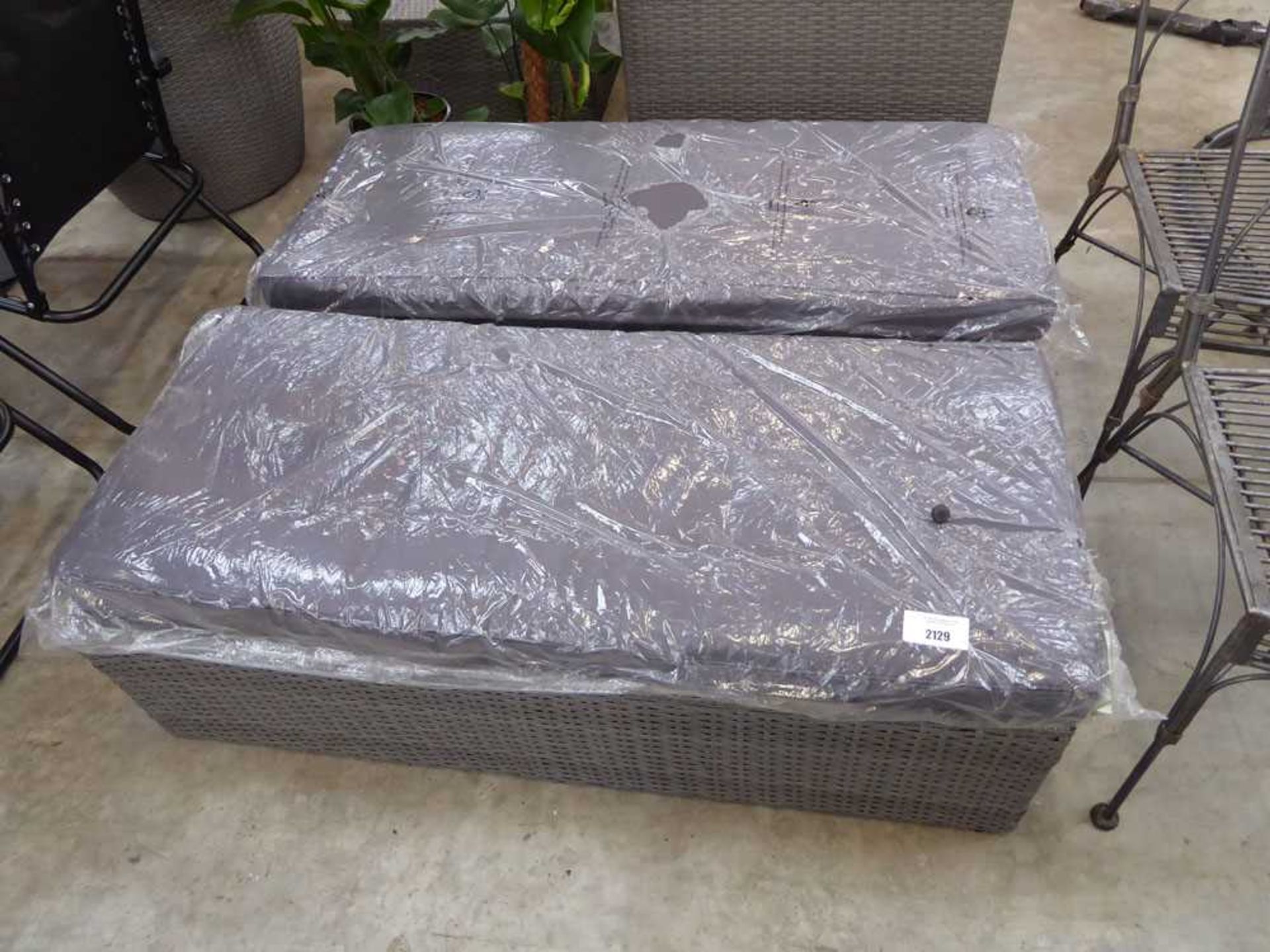 +VAT Pair of grey rattan 2 seater benches each with matching charcoal grey cushions