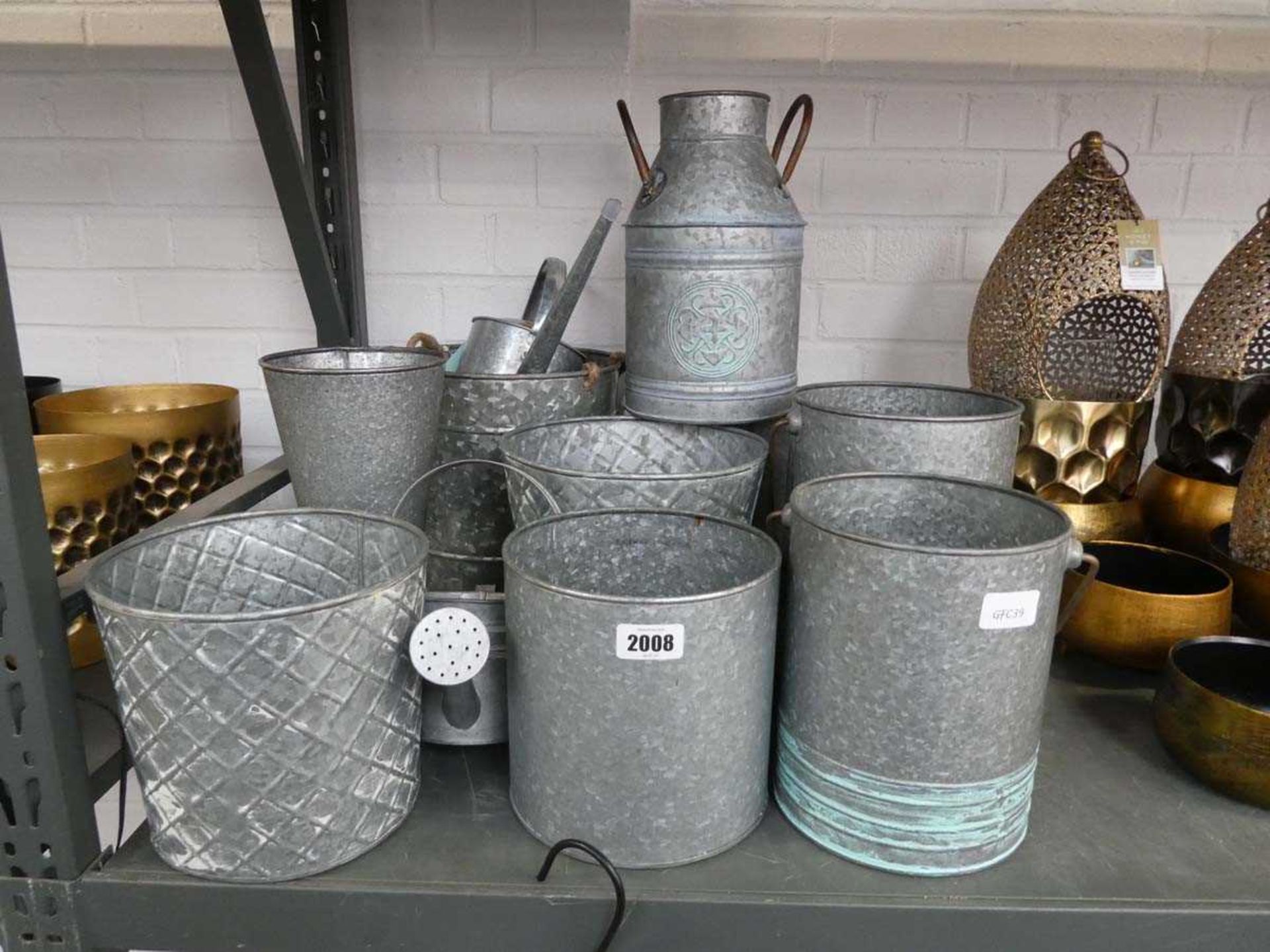 9 various sized galvanised pots, together with 2 miniature watering cans