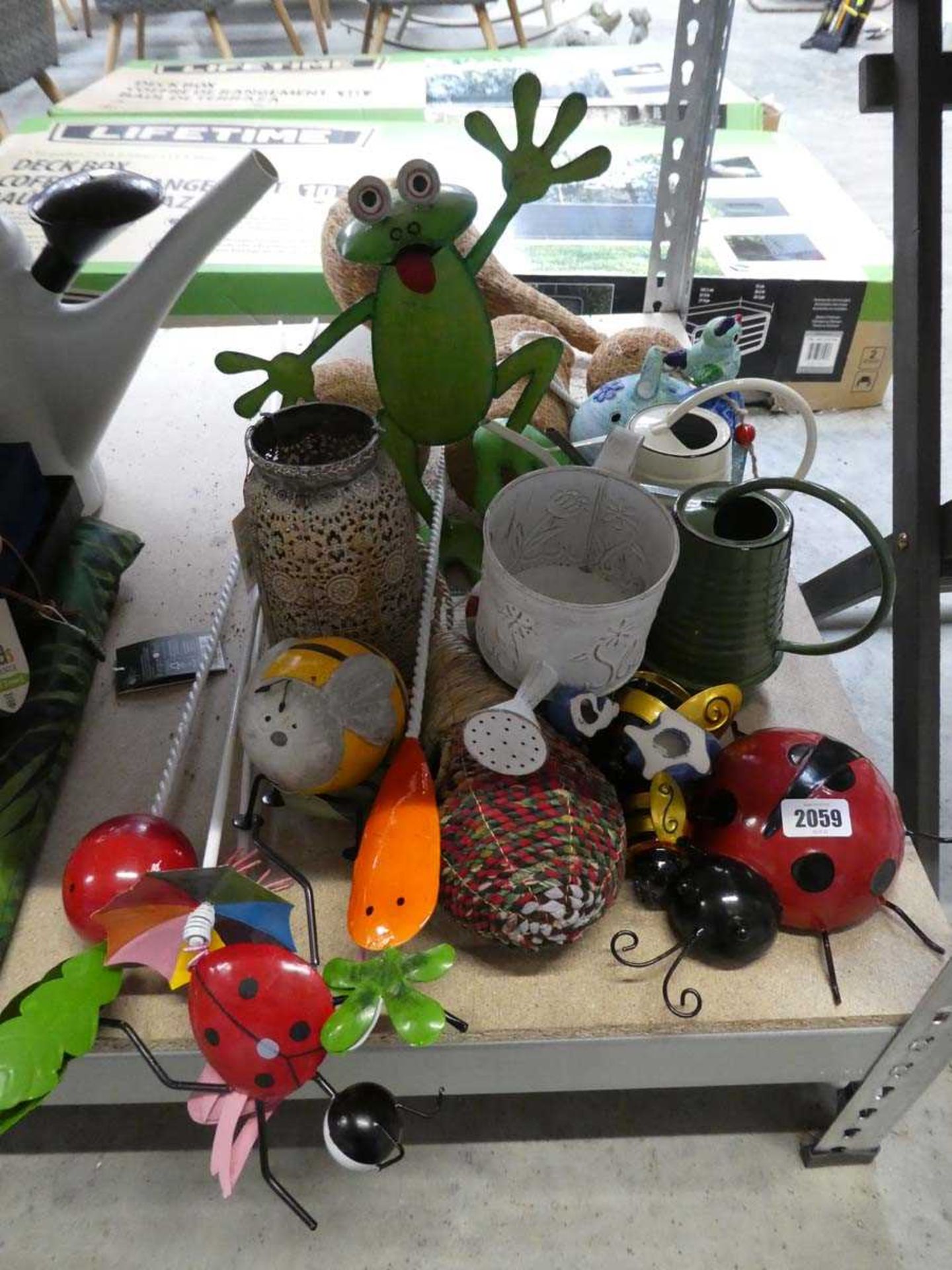 A quantity of mixed garden items, to include metal frog, metal ladybird, garden stakes, coco