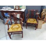 Pair of Chippendale style carver chairs with yellow padded seats