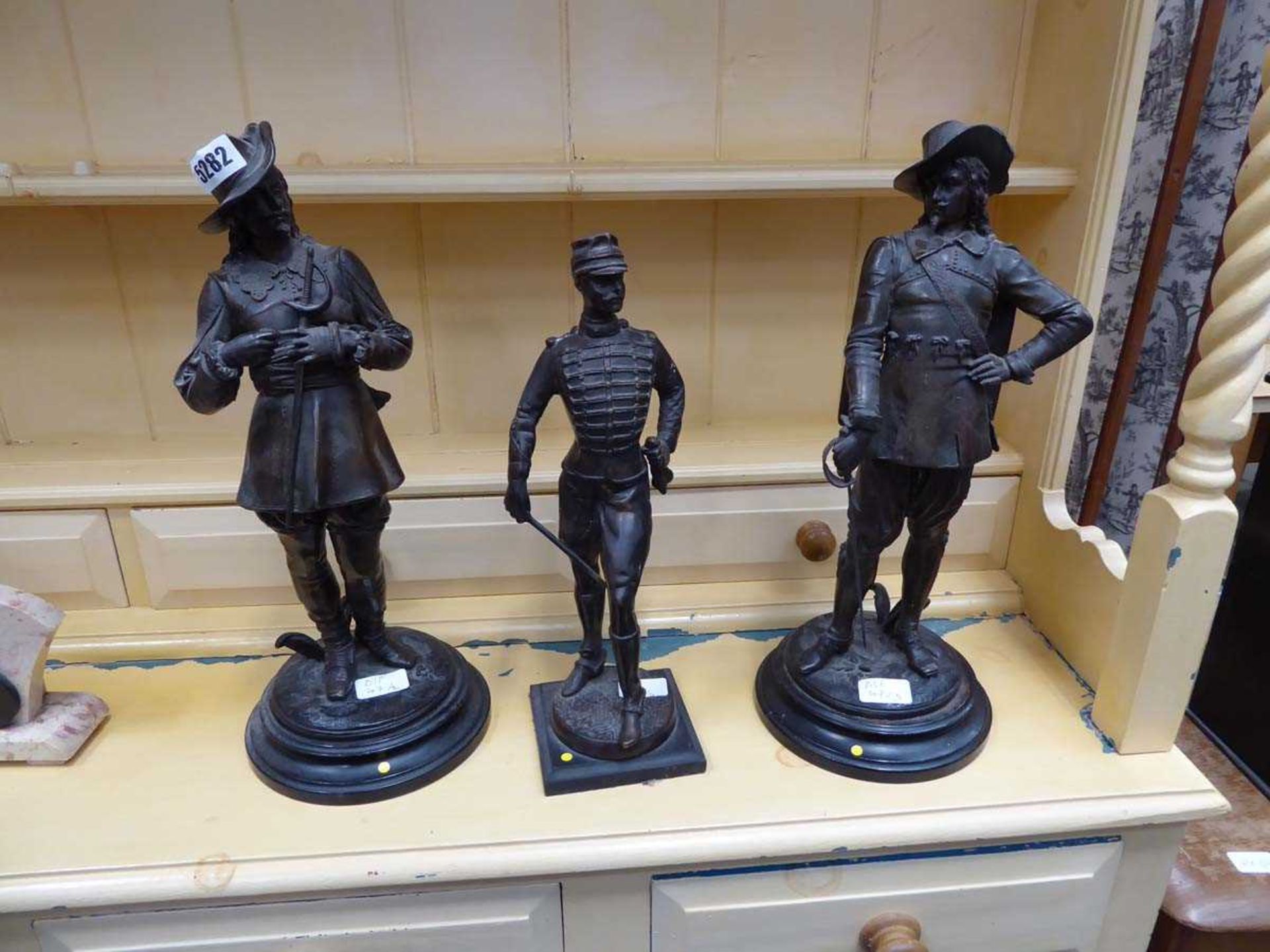 Two cavalier spelter figures plus a military officer